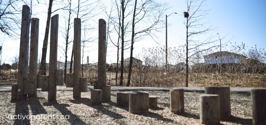 wooden play structures at hamilton parkette