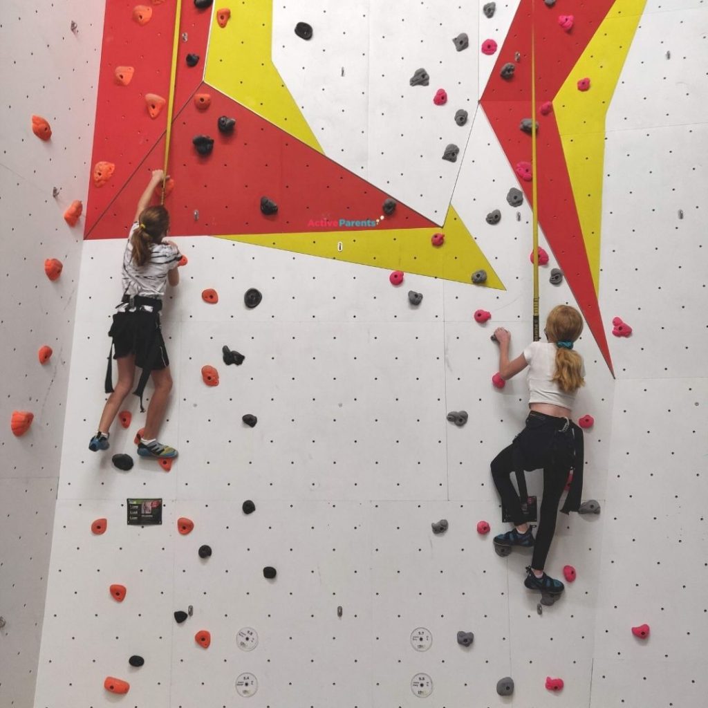 two girls Auto Belay climbing at The Hub in Mississauga