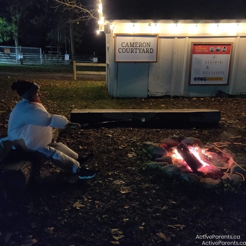 Mountsberg's Halloween Spooktacular roasting marshmallows by the fire