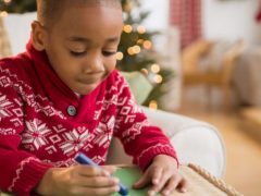 little boy writing his letter to santa
