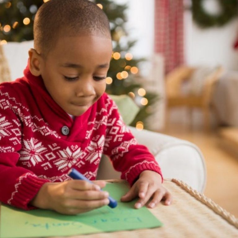 little boy writing his letter to santa