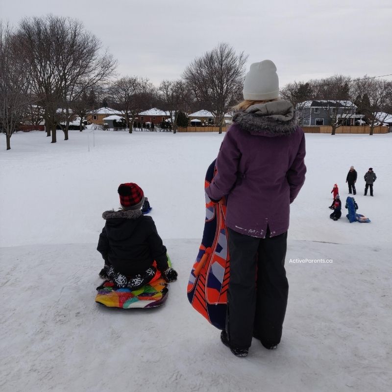 Kids at the top of Central Park toboggan hill in Burlington