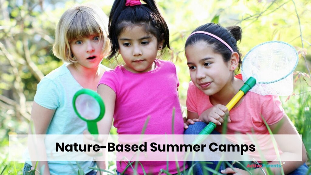 children using a magnifying glass at their outdoor summer camp