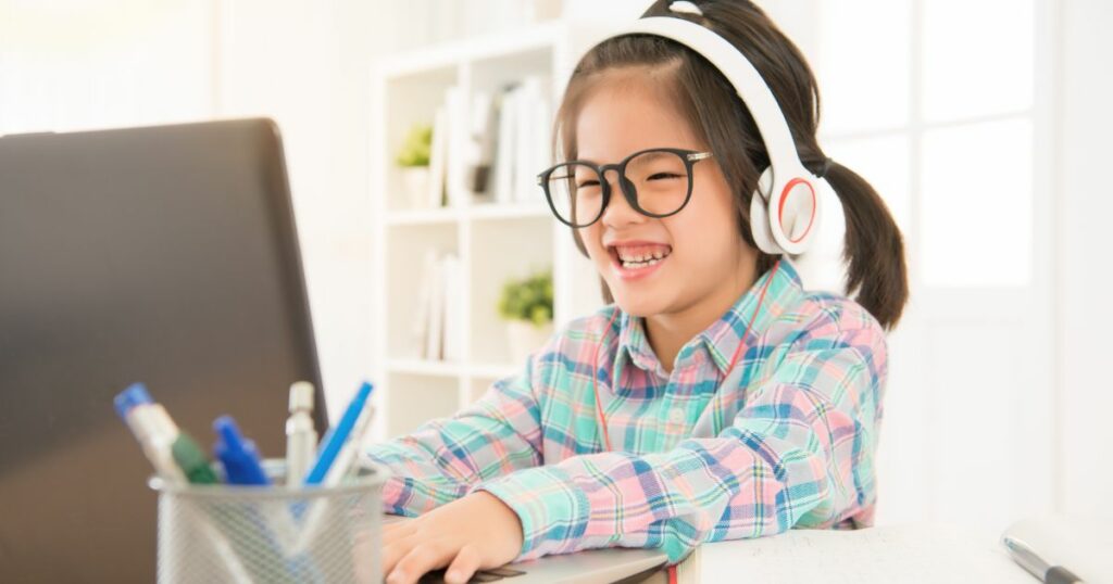 girl on the computer playing games and learning