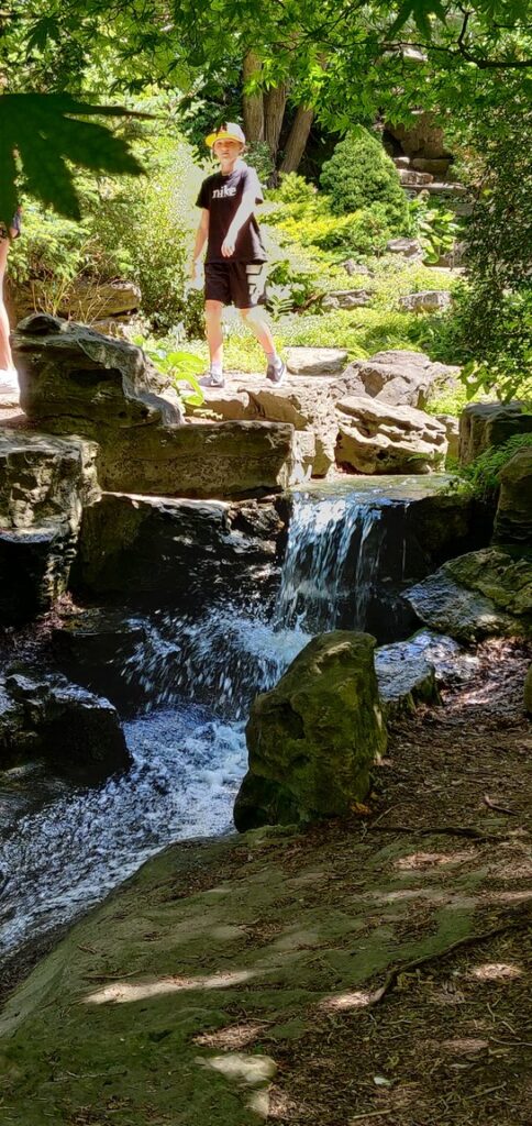 child exploring the hidden paths at RBG Rock Garden